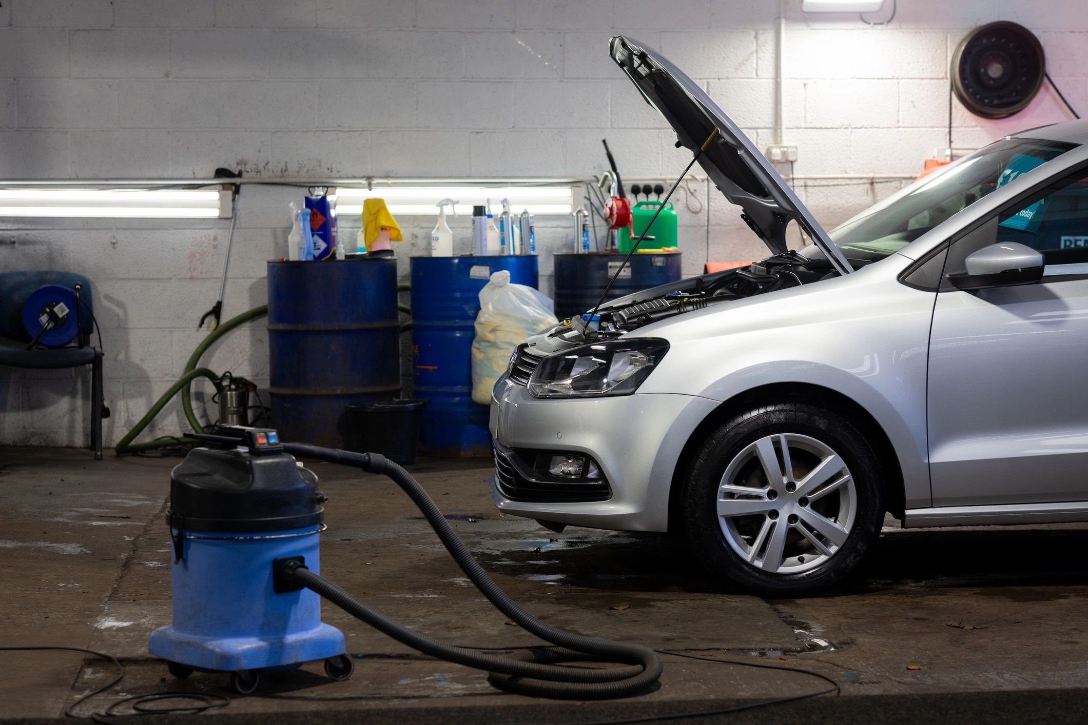 Vehicle being serviced in a clean garage bay