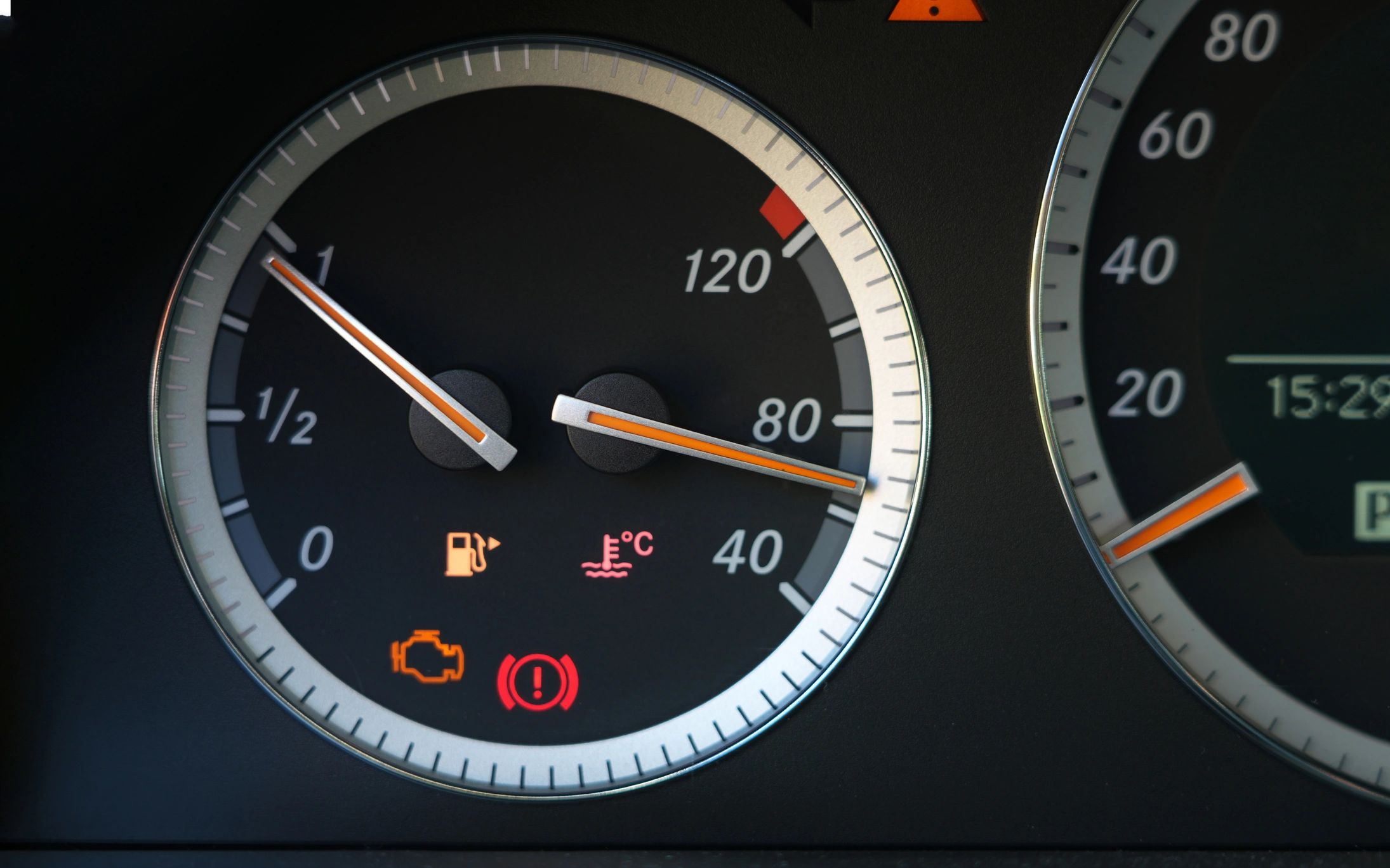 Car dashboard warning lights illuminated